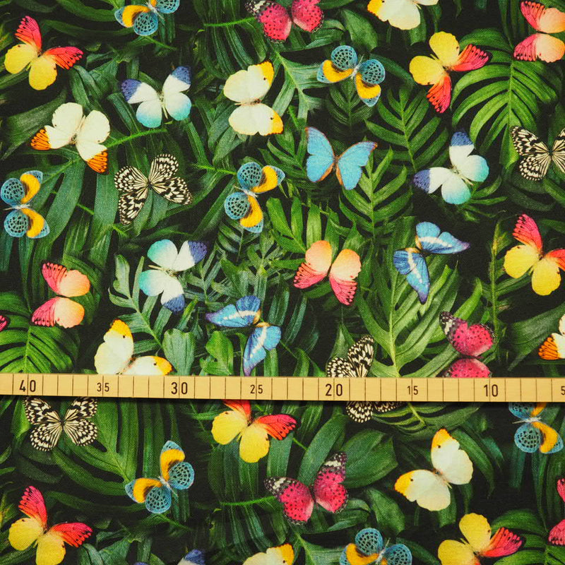 Palmenblätter und Schmetterlinge als Digitaldruck Canvas Dekostoff