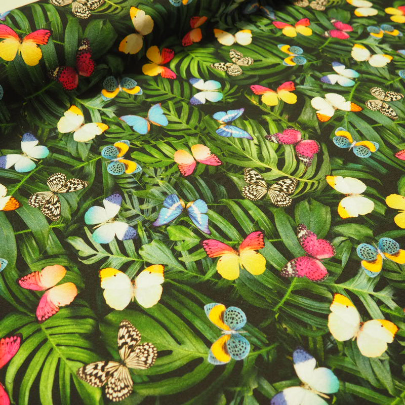 Palmenblätter und Schmetterlinge als Digitaldruck Canvas Dekostoff