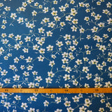 Mandelblüten blau und gelb auf beschichtetem Baumwollstoff coated